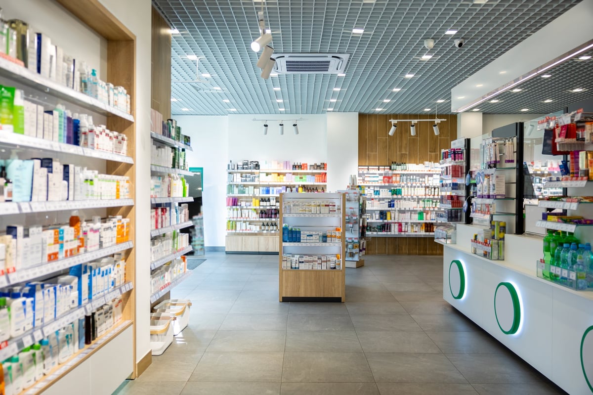 Pharmacy shelves stocked with medicines and health products