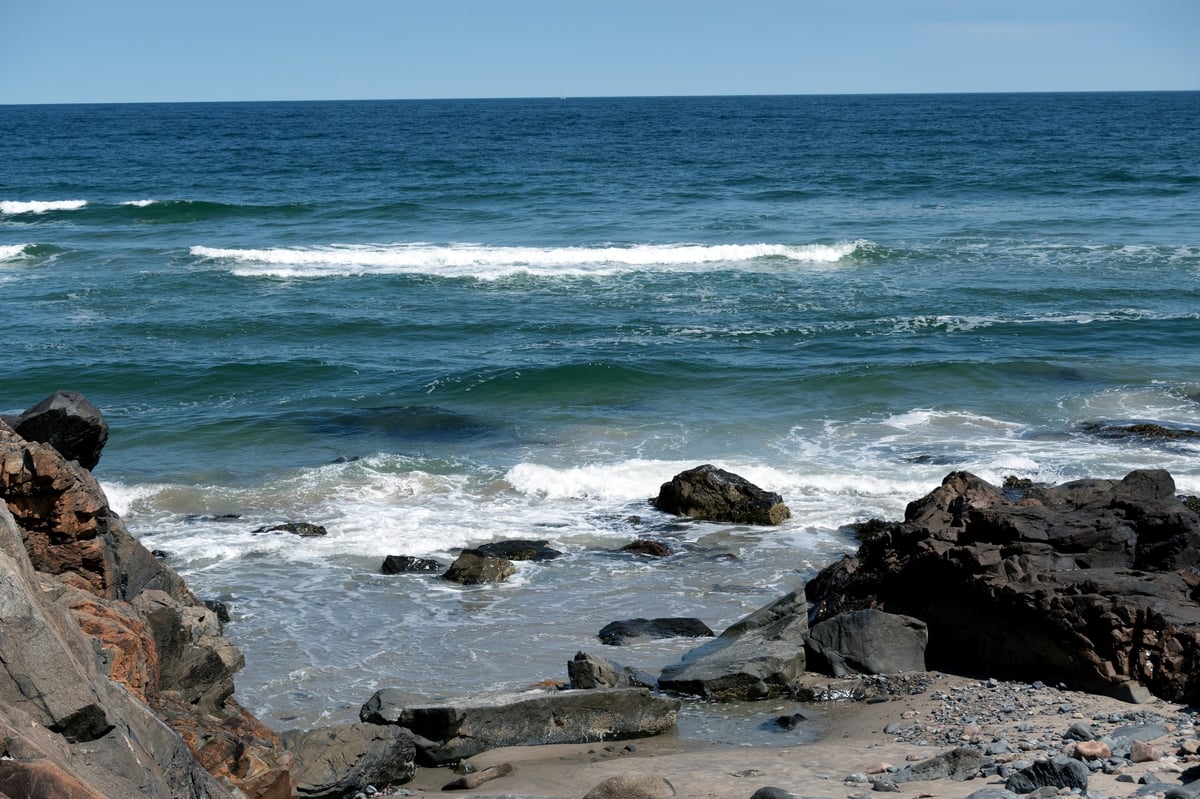 Breaking waves on a rocky shoreline in Maine